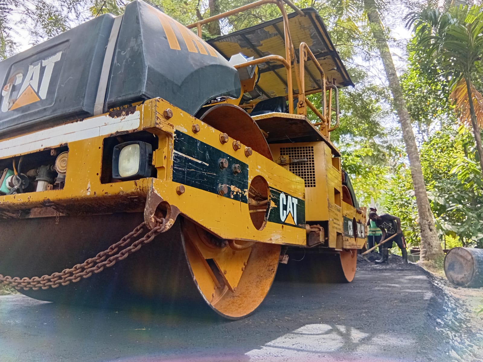 TRP asphalt paving crew laying hot mix tar road in Sri Lanka