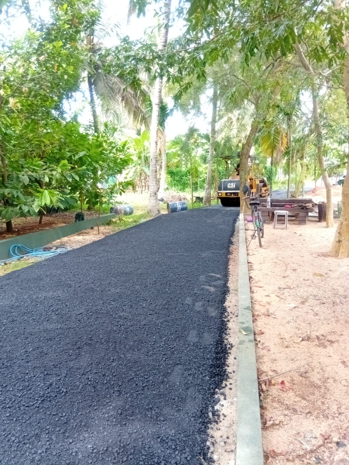 TRP concrete road construction crew completing municipal road in Sri Lanka